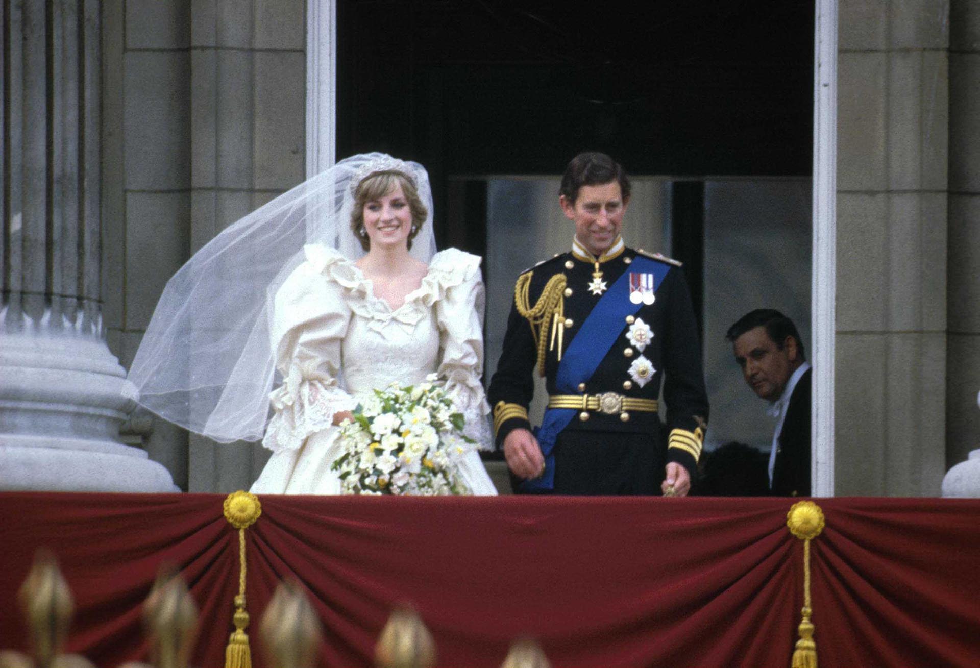 Prince Charles & Princess Diana (1961 - 1997) stand on the balcony of Buckingham Palace after their wedding ceremony at St. Paul