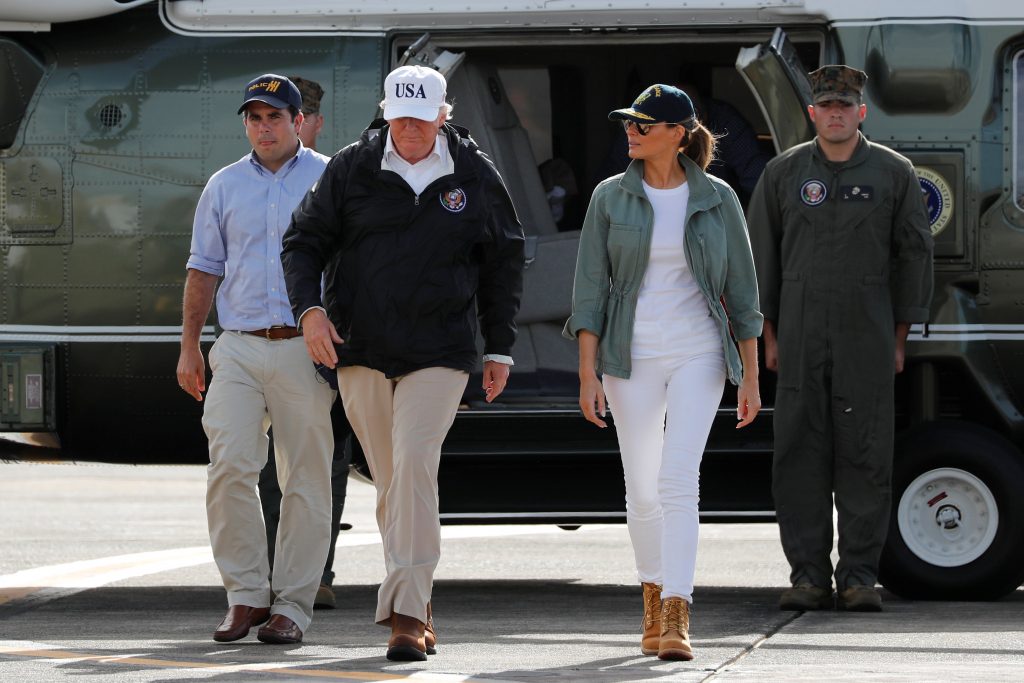 U.S. President Donald Trump and first lady Melania Trump depart Muniz Air National Guard Base in Carolina, Puerto Rico, U.S., after a tour of hurricane damage and relief efforts October 3, 2017. REUTERS/Jonathan Ernst