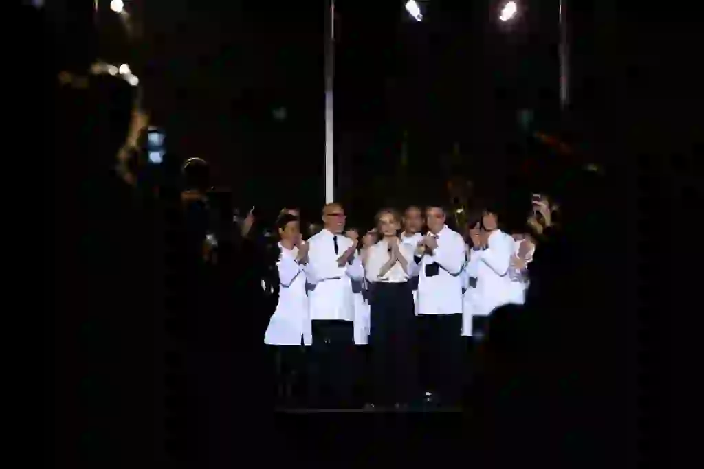 Designer Carolina Herrera and team members receive applause after presenting the Fall/Winter Women