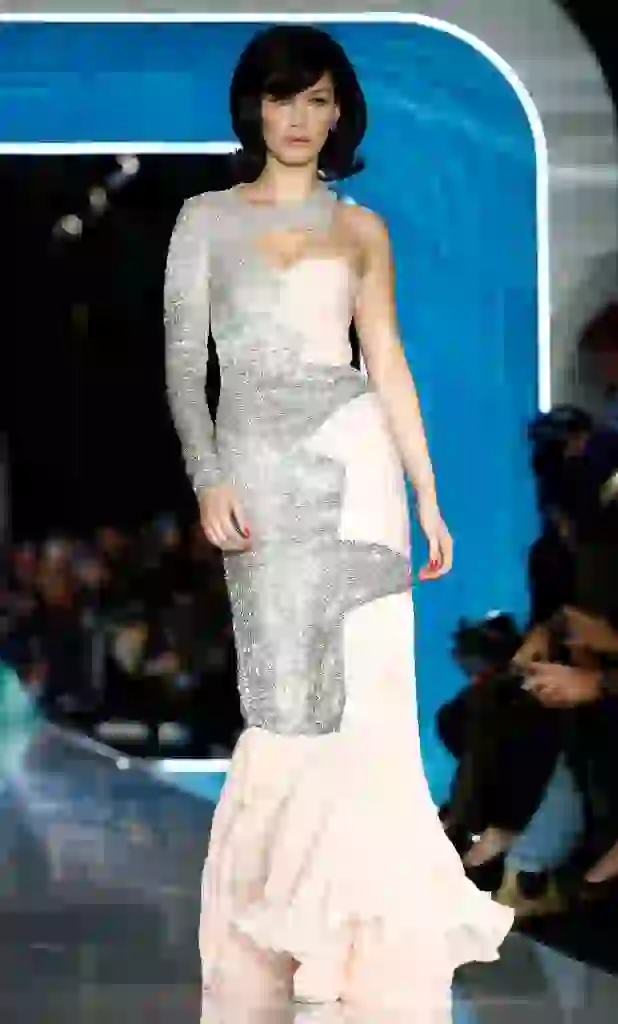 Model Bella Hadid presents a creation from the Moschino Autumn/Winter 2018 women collection during Milan Fashion Week in Milan, Italy February 21, 2018. REUTERS/Alessandro Garofalo