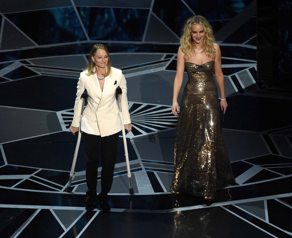 Jodie Foster, left, and Jennifer Lawrence present the award for best performance by an actress in a leading role at the Oscars on Sunday, March 4, 2018, at the Dolby Theatre in Los Angeles. (Photo by Chris Pizzello/Invision/AP)