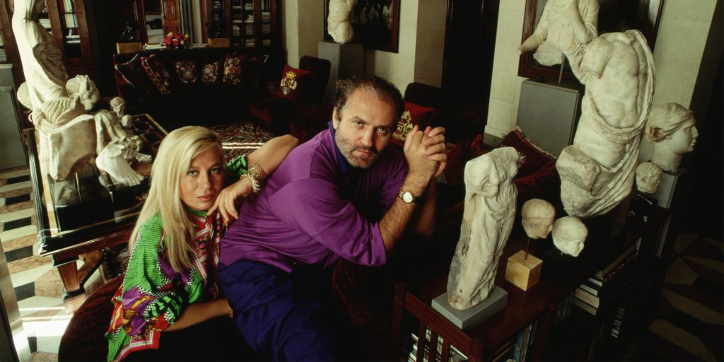 Fashion designer Donatella Versace and her brother Gianni sit among the artworks they have collected in their home in Milan. (Photo by © Stephanie Maze/CORBIS/Corbis via Getty Images)