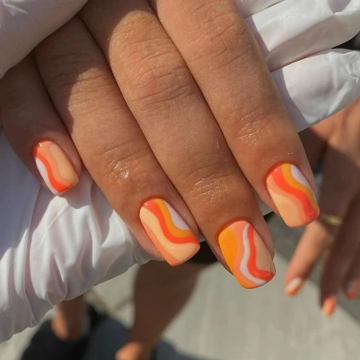 tendencia en anil art 2023, uñas orange