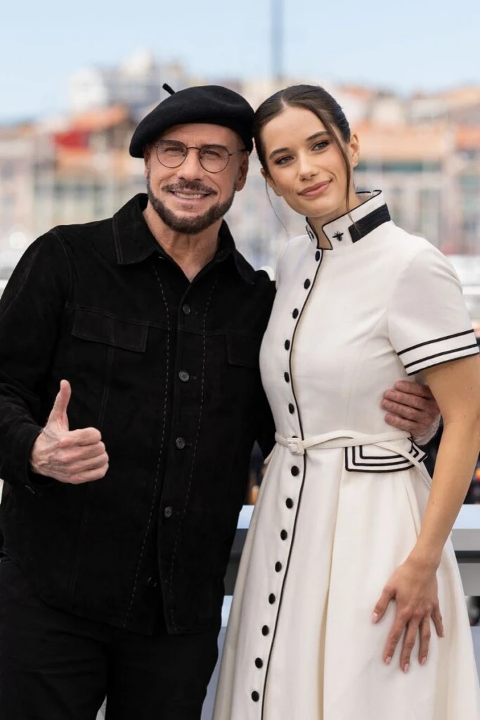 Ella Bleu Travolta, John Travolta’s daughter, makes her catwalk debut in Paris at the Miu Miu fashion show. John Travolta et sa fille Ella Bleue Travolta au photocall du film "Propeller One-Way Night Coach" lors du 79ème Festival International du Film de Cannes, France, le 16 mai 2026. — "Propeller One-Way Night Coach" photocall at the 79th annual Cannes Film Festival at Palais des Festivals on May 16, 2026 in Cannes, France.
